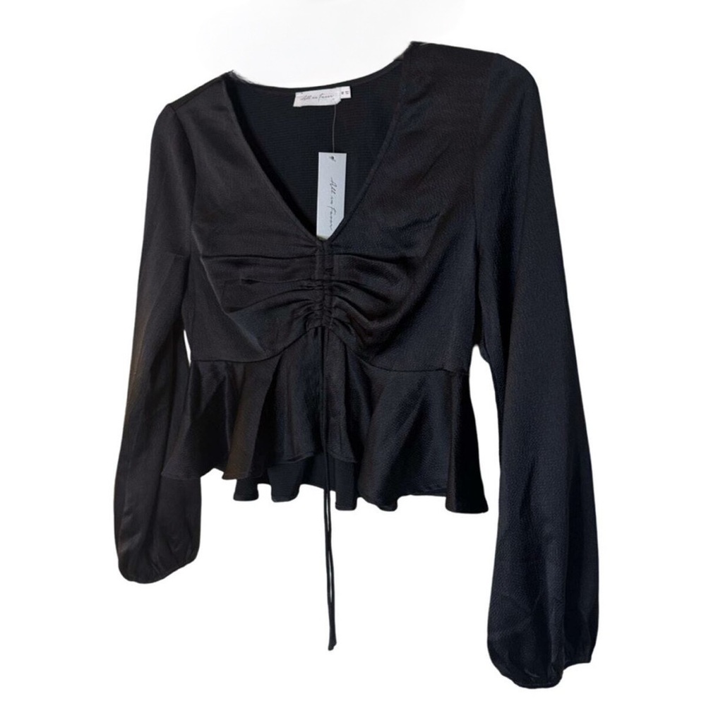 black "All in Favor Tie Front Satin Peplum Top" with a V-neck and long sleeves. - Picture 4 of 6